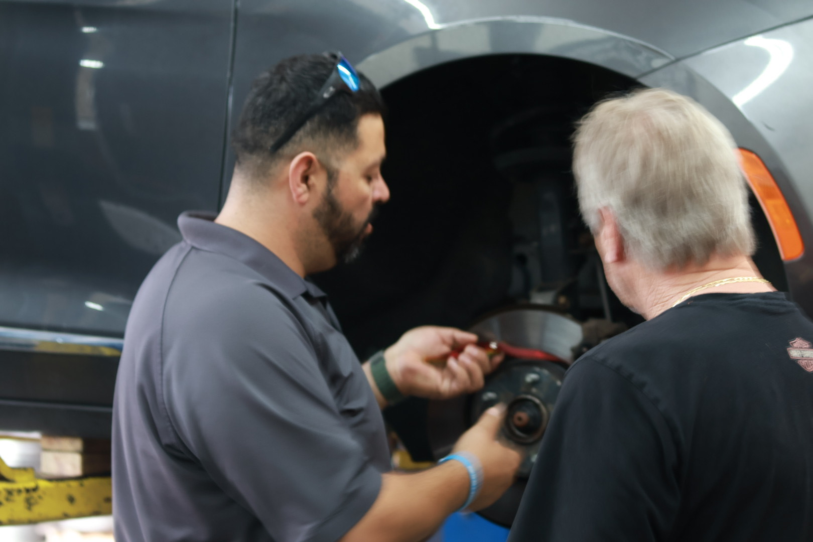 Mechanic inspecting brake components