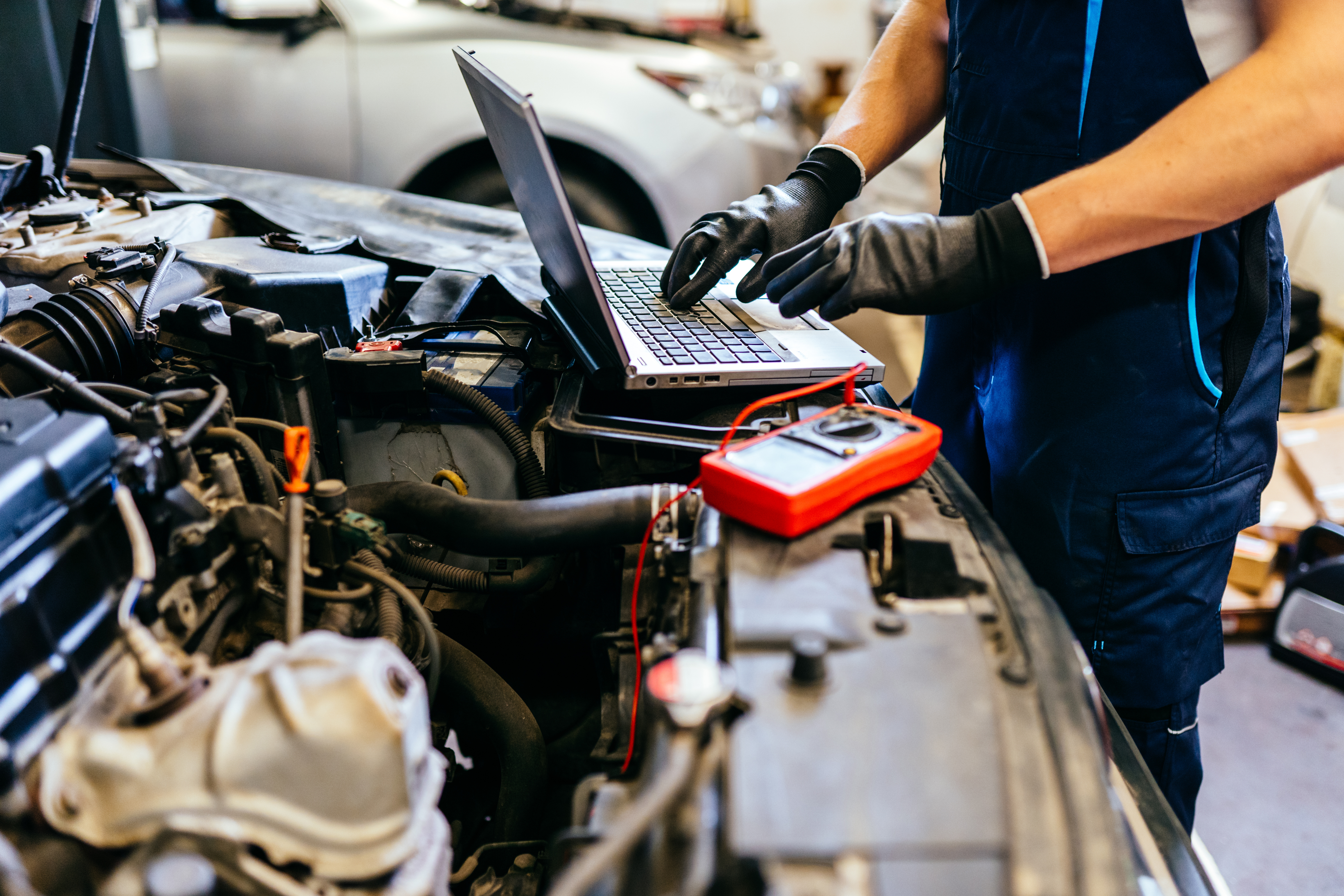 Technicians working on vehicle diagnostics